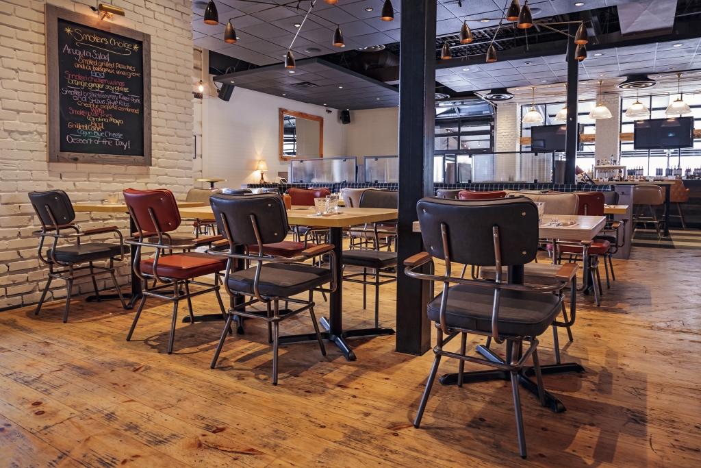 Barque Smokehouse with amazing dining area and black lounge chairs
