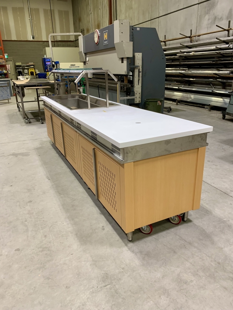 Servery Unit With Cold Well, Hot Wells, Soup Wells, an End Unit Tray Holder, Double Sneeze Guard, and Dinoc